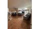 Open living area with tile flooring, comfortable seating, ceiling fans, and elegant window treatments at 105 Cattail Ct, Kissimmee, FL 34743