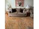 Comfortable living room featuring a couch, side tables with lamps, and tile flooring for easy maintenance at 105 Cattail Ct, Kissimmee, FL 34743