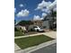 Street view shows a charming neighborhood with a variety of homes at 105 Cattail Ct, Kissimmee, FL 34743
