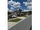 Street view showcasing diverse homes and verdant landscaping at 105 Cattail Ct, Kissimmee, FL 34743