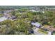 Aerial view of homes surrounded by lush trees and landscaping in a neighborhood at 1432 Mollie Rd, Daytona Beach, FL 32114