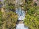 Overhead view of the house nestled among mature trees and surrounded by landscaping at 1432 Mollie Rd, Daytona Beach, FL 32114