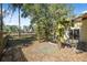 Spacious backyard featuring a wooden pergola and ample space for outdoor enjoyment at 1432 Mollie Rd, Daytona Beach, FL 32114