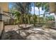 View of a large backyard with mature trees and a wooden pergola, great for relaxing at 1432 Mollie Rd, Daytona Beach, FL 32114