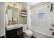 Updated bathroom with shower and tub combination, bright vanity, and tasteful decor at 1432 Mollie Rd, Daytona Beach, FL 32114
