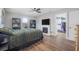 This bedroom features laminate floors, a built-in fireplace, and a large walk-in closet at 1432 Mollie Rd, Daytona Beach, FL 32114