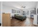 Cozy bedroom featuring laminate flooring, ceiling fan, and abundant natural light at 1432 Mollie Rd, Daytona Beach, FL 32114