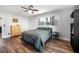 The main bedroom includes a ceiling fan, a large window, and laminate floors at 1432 Mollie Rd, Daytona Beach, FL 32114