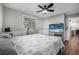 Comfortable bedroom with wood-look floors and a ceiling fan for temperature regulation at 1432 Mollie Rd, Daytona Beach, FL 32114