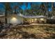 Charming yellow house featuring attached garage and beautiful landscaping at 1432 Mollie Rd, Daytona Beach, FL 32114