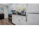 Well-equipped kitchen with modern appliances, sleek countertops, and ample storage space in white cabinetry at 1432 Mollie Rd, Daytona Beach, FL 32114
