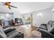 Bright living room with recessed lights, ceiling fan and sliding glass door to backyard at 1432 Mollie Rd, Daytona Beach, FL 32114