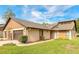 Inviting home featuring a well-manicured lawn, two-car garage, and complementary exterior paint at 206 Sage Brush Trl, Ormond Beach, FL 32174