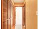 Hallway featuring wood floors and louvered closet doors at 206 Sage Brush Trl, Ormond Beach, FL 32174