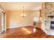 Bright and spacious living room with hardwood floors, a stone fireplace, and great natural light at 206 Sage Brush Trl, Ormond Beach, FL 32174