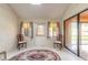 Enclosed patio featuring sliding glass doors, plenty of light, and cozy seating at 206 Sage Brush Trl, Ormond Beach, FL 32174
