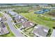 An aerial view of a one story home with manicured lawn and landscaping and an attached two car garage at 251 Island Breeze Ave, Daytona Beach, FL 32124