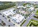 An aerial view of a shopping center with many stores, parking, and some amenities such as tennis courts and pools at 251 Island Breeze Ave, Daytona Beach, FL 32124