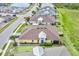 An aerial view of a one story home with manicured lawn and landscaping and an attached two car garage at 251 Island Breeze Ave, Daytona Beach, FL 32124