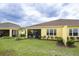 Relaxing screened-in lanai and well-maintained backyard create an inviting outdoor living space at 251 Island Breeze Ave, Daytona Beach, FL 32124