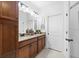 Bathroom featuring double sinks, granite countertops, and vanity lighting at 251 Island Breeze Ave, Daytona Beach, FL 32124