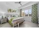 Comfortable bedroom with a king bed, soft lighting, and tropical-themed decor at 251 Island Breeze Ave, Daytona Beach, FL 32124