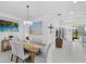 Bright dining room with modern table and chairs, beachy decor, and views of the outdoors at 251 Island Breeze Ave, Daytona Beach, FL 32124