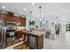 Beautiful eat-in kitchen with an island, granite countertops, stainless steel appliances, and modern lighting at 251 Island Breeze Ave, Daytona Beach, FL 32124