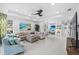 Spacious living room with neutral sofa, stylish decor, and large windows for natural light at 251 Island Breeze Ave, Daytona Beach, FL 32124