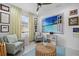 Bright office with a beach view mural, and two grey upholstered chairs at 251 Island Breeze Ave, Daytona Beach, FL 32124