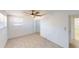 Clean and spacious bedroom with neutral decor, tile flooring and ceiling fan at 30 Azalea Dr, Ormond Beach, FL 32176