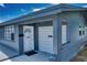 Close up of a charming single-story home with a garage, and front door at 30 Azalea Dr, Ormond Beach, FL 32176
