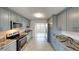 Modern kitchen with stainless steel appliances, granite countertops and stylish cabinets at 30 Azalea Dr, Ormond Beach, FL 32176
