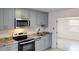 Modern kitchen with stainless steel appliances, granite countertops and stylish cabinets at 30 Azalea Dr, Ormond Beach, FL 32176