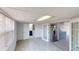 Open living space with tile floors, modern cabinetry, and stainless steel refrigerator at 30 Azalea Dr, Ormond Beach, FL 32176