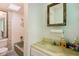 Bathroom featuring a tub and shower, a vanity, and a skylight at 322 Garden St, Daytona Beach, FL 32114