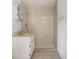 Bathroom with tiled walk-in shower and neutral-colored vanity at 322 Garden St, Daytona Beach, FL 32114