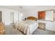 Bedroom with closet, bed, and matching end table at 322 Garden St, Daytona Beach, FL 32114