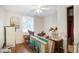 Bedroom with hardwood floors, a ceiling fan, and natural light from the window at 322 Garden St, Daytona Beach, FL 32114