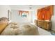 Bedroom with neutral carpet, matching bed set, and window with curtains at 322 Garden St, Daytona Beach, FL 32114