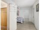 Bedroom view features tiled flooring and neutral paint, transitioning to a bathroom with shower at 322 Garden St, Daytona Beach, FL 32114