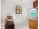Bright kitchen with white tile, cabinets, and appliances at 322 Garden St, Daytona Beach, FL 32114