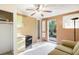 Living room with tiled flooring, easy access to backyard, and kitchenette at 322 Garden St, Daytona Beach, FL 32114