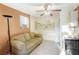 The living room has painted walls, tiled flooring, and built in kitchen appliances at 322 Garden St, Daytona Beach, FL 32114