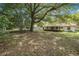 Spacious backyard with mature trees offering a serene setting at 3385 Ne 44Th Pl, Ocala, FL 34479