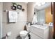 Cozy bathroom featuring a modern vanity and decorative floating shelves at 3385 Ne 44Th Pl, Ocala, FL 34479
