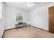 Bright bedroom with neutral walls and carpet, and a big window at 3385 Ne 44Th Pl, Ocala, FL 34479
