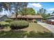 Charming single-story brick home featuring a well-maintained front yard and attached garage at 3385 Ne 44Th Pl, Ocala, FL 34479