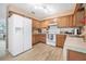 Bright kitchen with stainless steel appliances and wood look flooring at 3385 Ne 44Th Pl, Ocala, FL 34479