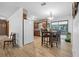 Inviting kitchen and dining area with modern lighting and wood floors at 3385 Ne 44Th Pl, Ocala, FL 34479